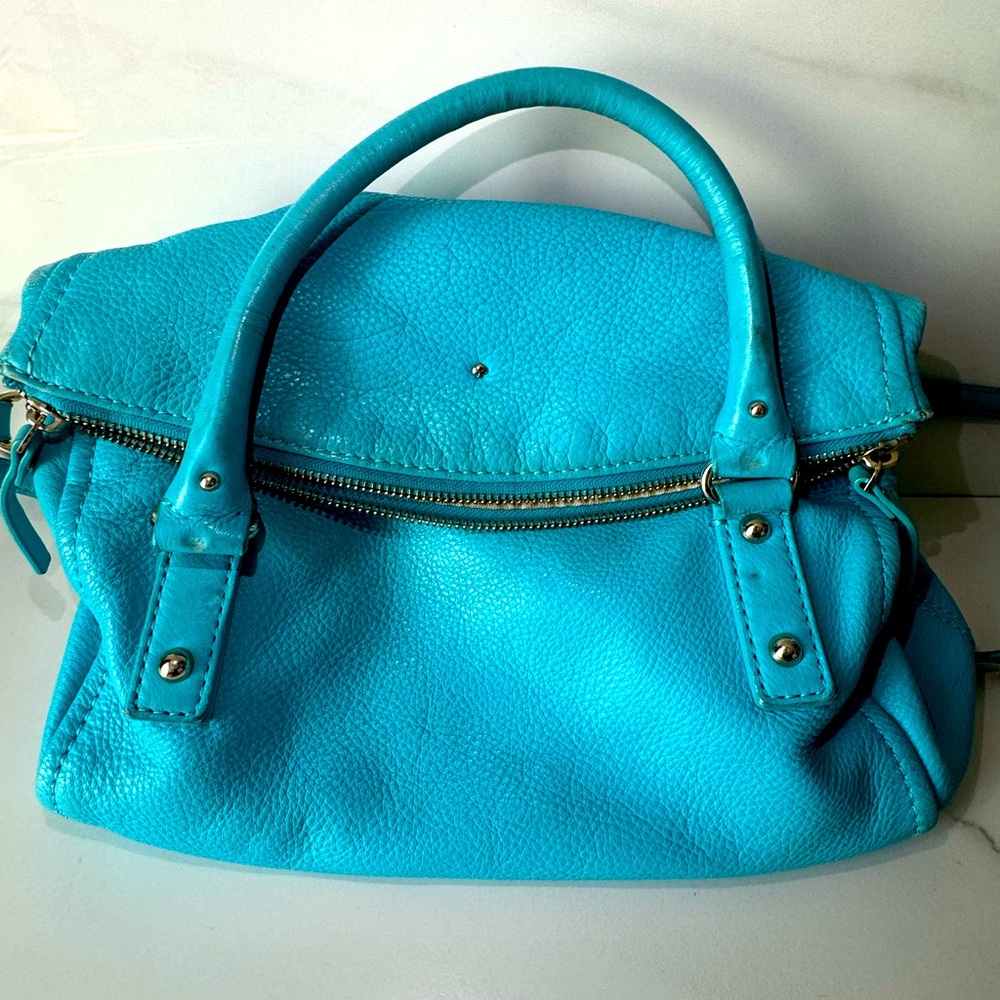 Pre loved Kate Spade convertible crossbody with visible signs of wear and fade